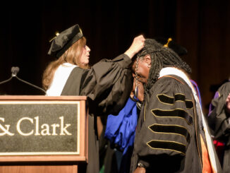 Chair of Board of Trustees Stephanie Fowler places a medallion on President Robin Holmes-Sullivan at inaugural ceremony