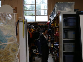 Students working in the College Outdoors warehouse