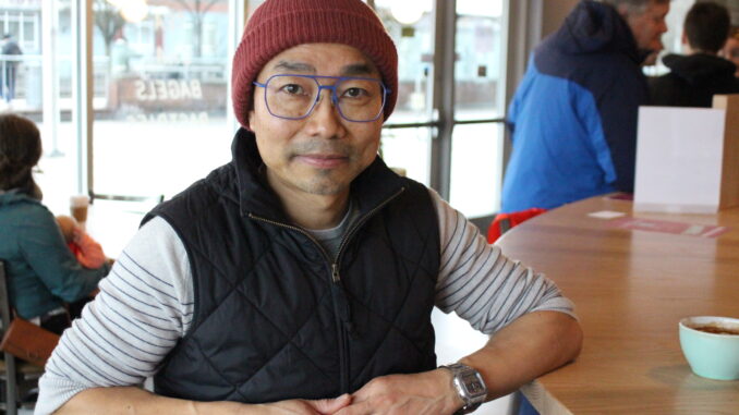 Khupsamlian Khaute, founder of Jubilee Hall PDX poses for the camera on opening day