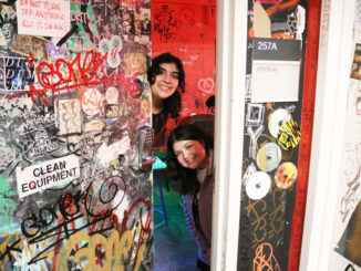 Photo of two DJs in the KPH doorway.
