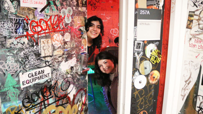 Photo of two DJs in the KPH doorway.