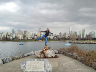 Rosalie posing and smiling, arms outstretched, in Canada (photo)