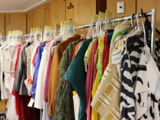 Costumes hanging on a rack.